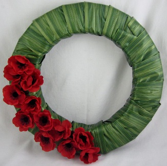 Remembrance Day Wreath Partly Covered  |  Periwinkle Flowers Toronto